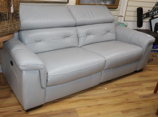 A pair of modern electrically operated grey leather upholstered two seater settees, the seating incorporating USB ports Larger 220cm